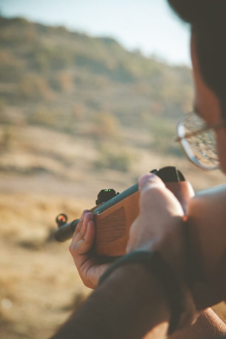 Close-up of person holding a firearm