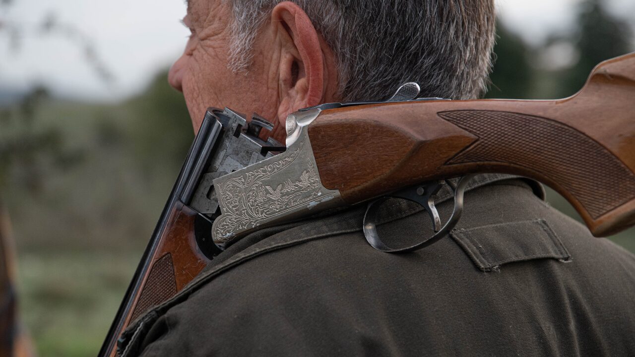 Man holding hunting rifle